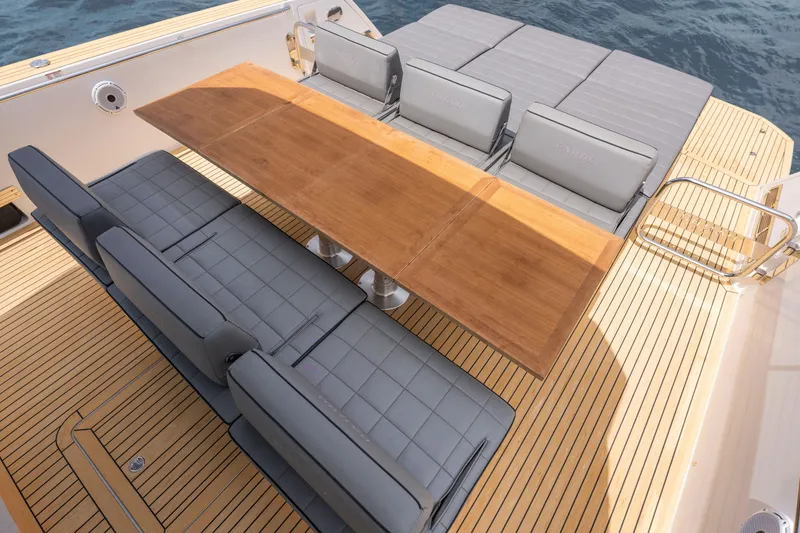 Slide: The Image of Luxury seating and wooden table on 2024 Pardo Yachts 43 deck. - 43