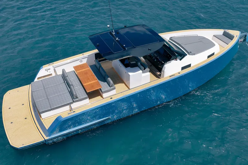 Slide: The Image of 2024 Pardo Yachts 43 cruising on blue ocean waters, showcasing sleek design and spacious deck. - 5