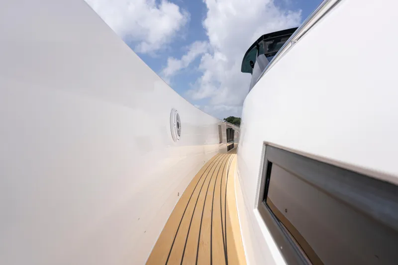 Slide: The Image of 2024 Pardo Yachts 43 deck with sleek design and wooden flooring. - 54