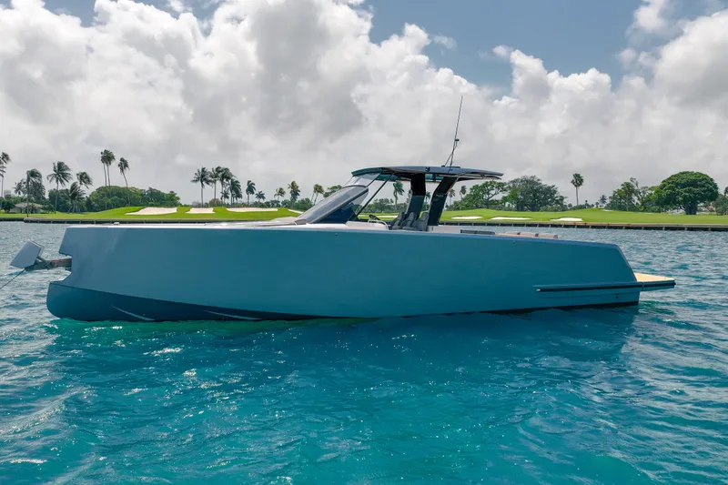 Slide: The Image of 2024 Pardo Yachts 43 cruising on clear blue water under a cloudy sky. - 8
