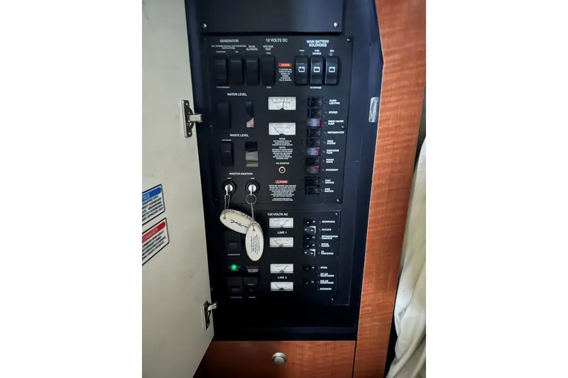 Slide: The Image of Electrical control panel on a 2006 Sea Ray 340 Sundancer boat. - 12