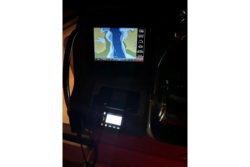 Slide: The Image of Dashboard of 2006 Sea Ray 340 Sundancer with navigation display at night. - 13