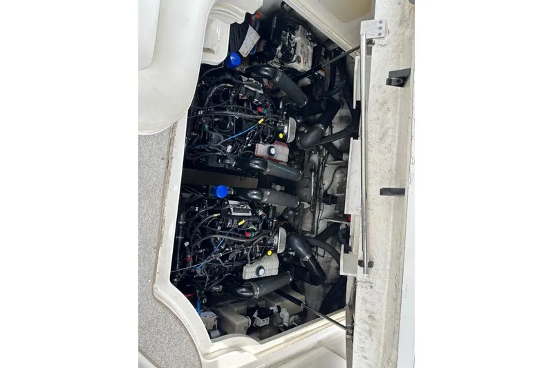 Slide: The Image of Engine compartment of a 2006 Sea Ray 340 Sundancer boat, showcasing complex machinery. - 15