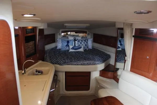 Slide: The Image of Interior of 2006 Sea Ray 340 Sundancer with cozy bed and kitchenette. - 9