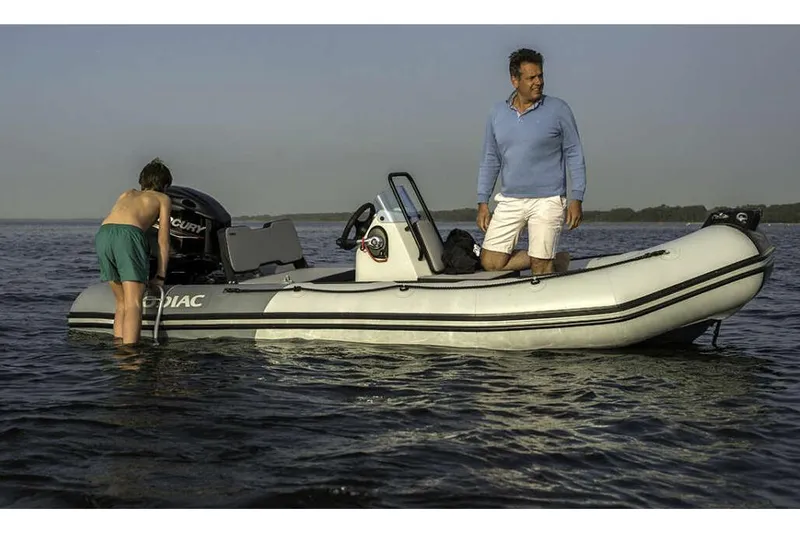 Slide: The Image of Manufacturer Provided Image: Zodiac Open 4.2 boat on water, two people aboard, 2026 model. - 2
