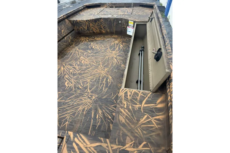 Slide: The Image of 2026 G3 Gator Tough 16 DK boat interior with camouflage design and storage compartment. - 5