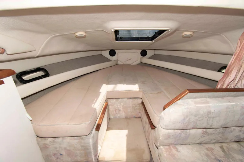 Slide: The Image of Interior cabin of 1994 Bayliner 2855 Ciera boat, featuring cozy sleeping area. - 9