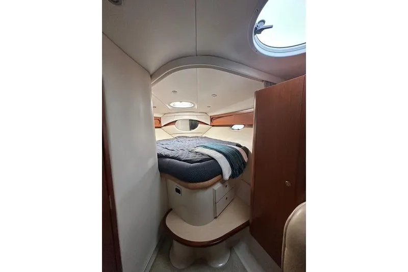 Slide: The Image of Interior cabin of 2003 Four Winns 378 Vista yacht with cozy bed and porthole. - 16