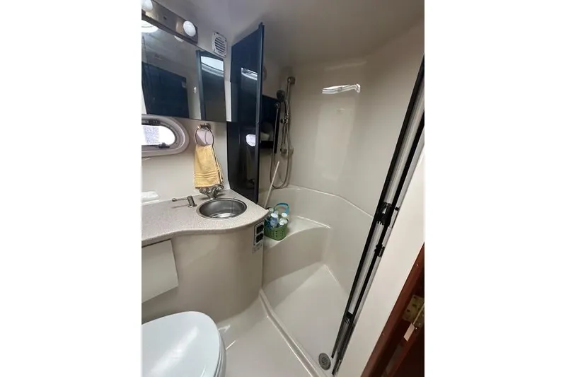 Slide: The Image of Bathroom interior of 2003 Four Winns 378 Vista yacht, featuring sink and shower. - 17