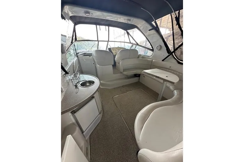 Slide: The Image of Interior of 2003 Four Winns 378 Vista boat with seating and kitchenette. - 3