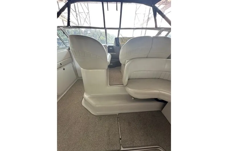 Slide: The Image of Interior of 2003 Four Winns 378 Vista boat with white seating and carpeted floor. - 5