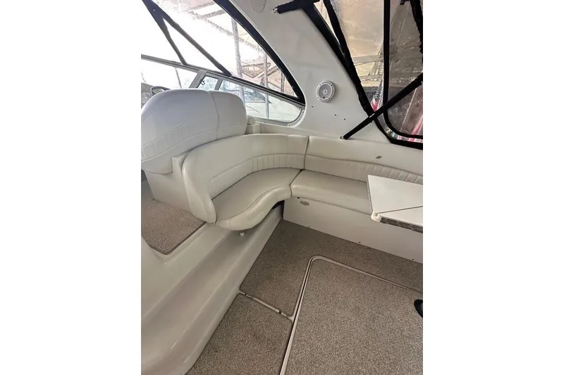 Slide: The Image of Interior of 2003 Four Winns 378 Vista boat with white seating and carpeted floor. - 6