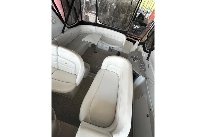 Slide: The Image of Interior of 2003 Four Winns 378 Vista boat with white seating and table. - 7