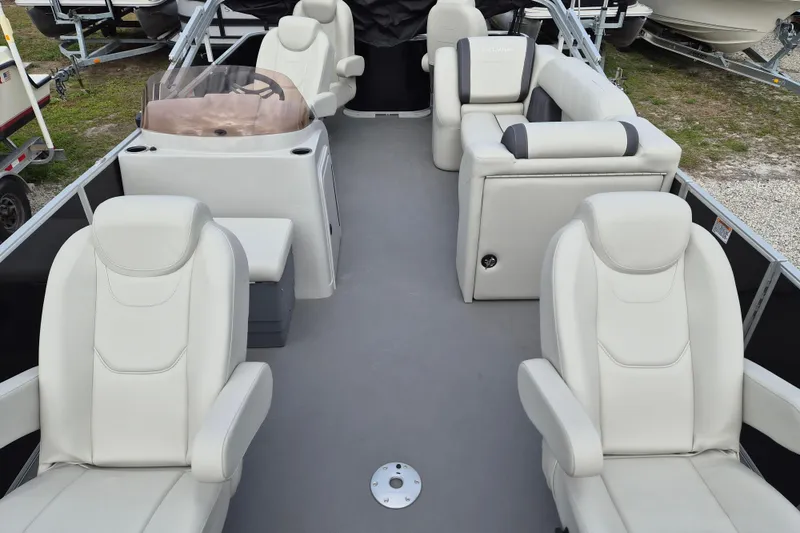 Slide: The Image of 2025 Sylvan Mirage Fish 8522 Party Fish 4.0 interior with luxurious seating. - 2