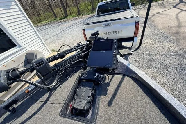 Slide: The Image of 2021 Ranger Z520L Cup-Equipped boat with advanced navigation system, parked near a Tundra truck. - 28