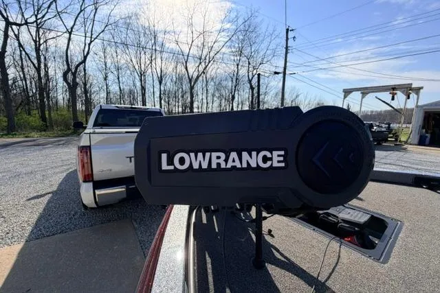 Slide: The Image of 2021 Ranger Z520L Cup-Equipped boat with Lowrance equipment, parked near a white truck. - 29