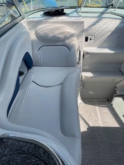 Slide: The Image of 2023 Crownline 270 CR boat interior with white seating and modern design. - 14