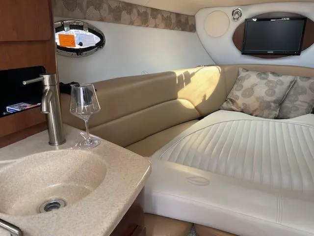 Slide: The Image of Luxurious interior of 2023 Crownline 270 CR boat with cozy seating and modern amenities. - 24