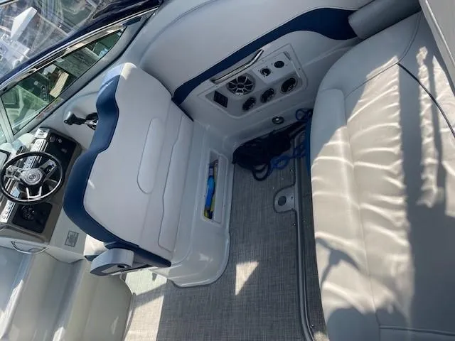 Slide: The Image of Interior of 2023 Crownline 270 CR boat with white and blue seating. - 28