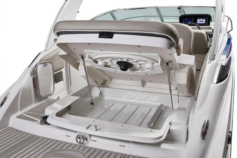 Slide: The Image of 2023 Crownline 270 CR boat with open storage compartment and seating area. - 34