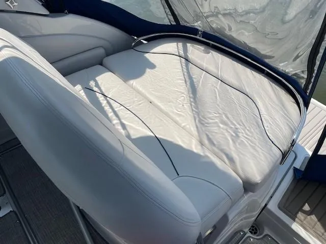Slide: The Image of 2023 Crownline 270 CR boat interior with white leather seating. - 6