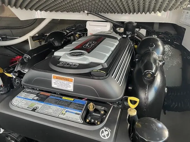 Slide: The Image of 2023 Crownline 270 CR engine compartment with detailed view of the engine components. - 7