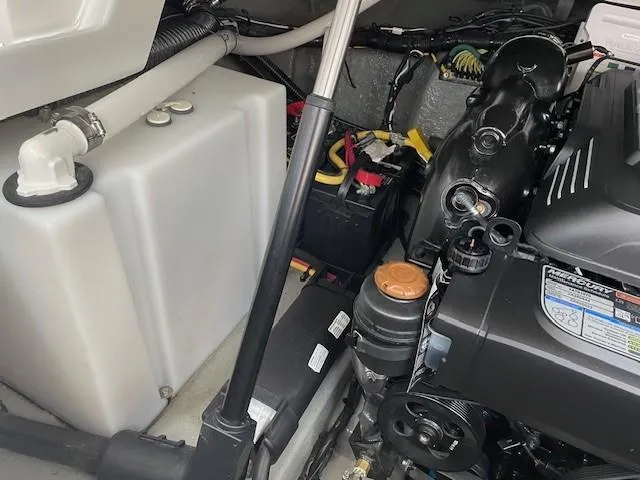 Slide: The Image of Engine compartment of 2023 Crownline 270 CR boat, showing components and wiring. - 9