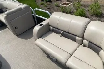 Slide: The Image of 2023 Sun Tracker SportFish 22 DLX pontoon boat with comfortable seating and sleek design. - 10