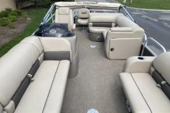 Slide: The Image of 2023 Sun Tracker SportFish 22 DLX pontoon boat with spacious seating and modern design. - 12
