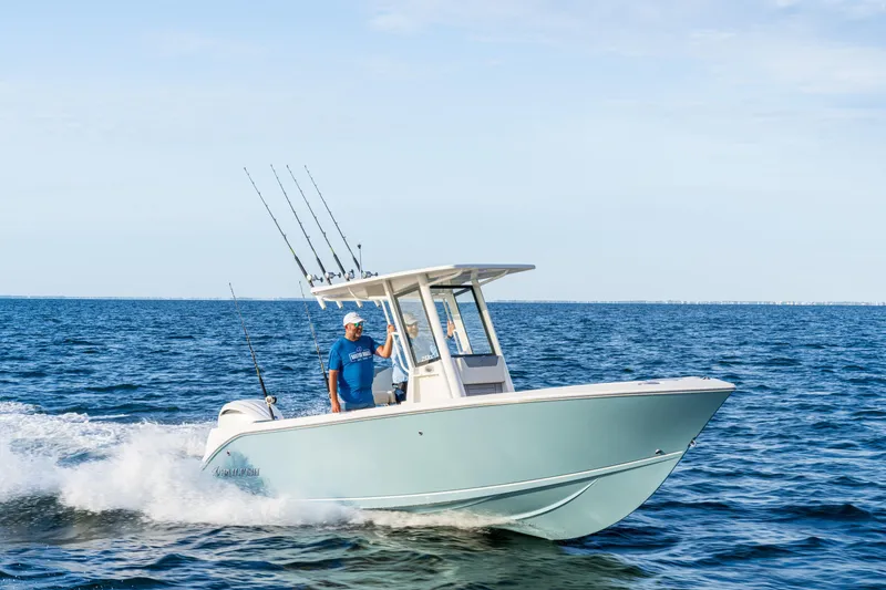 The Image of 2027 Sailfish 232 CC boat cruising on open water with fishing rods. - 0