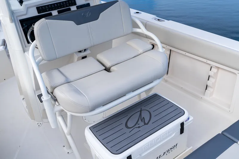 Slide: The Image of 2027 Sailfish 232 CC boat interior with cushioned seating and Engel cooler on deck. - 14
