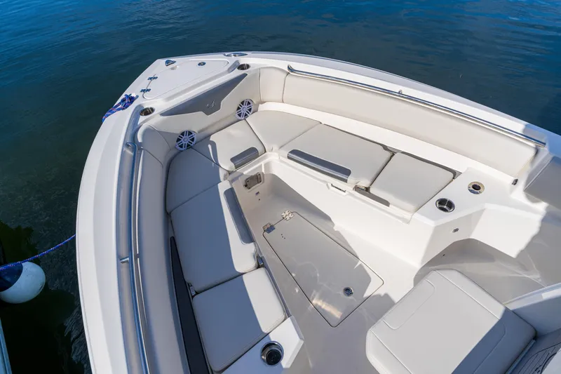 Slide: The Image of 2027 Sailfish 232 CC boat interior with cushioned seating and cup holders. - 4