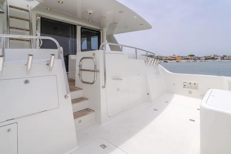Slide: The Image of 2006 Cheoy Lee 72' Raised Pilot House yacht deck with sleek design and waterfront view. - 12