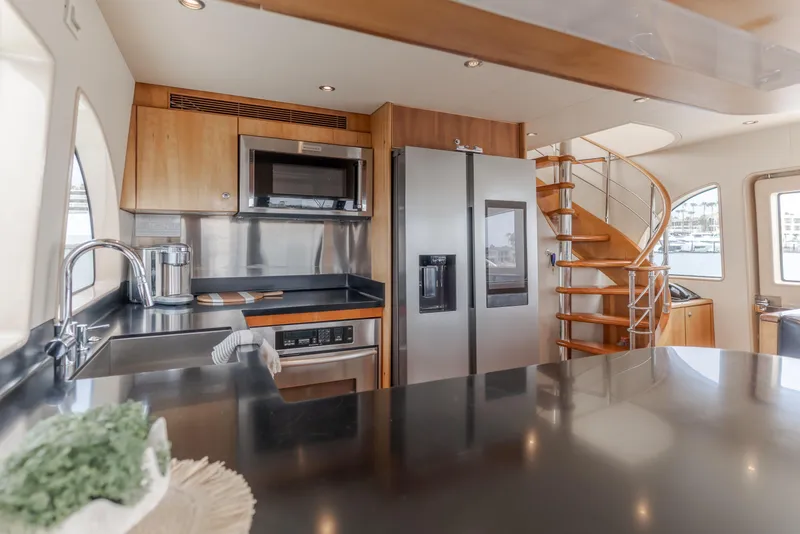 Slide: The Image of Luxurious kitchen interior of 2006 Cheoy Lee 72' Raised Pilot House yacht with modern appliances. - 20