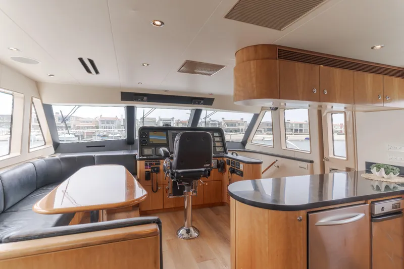 Slide: The Image of Luxurious interior of a 2006 Cheoy Lee 72' Raised Pilot House yacht with modern helm. - 23