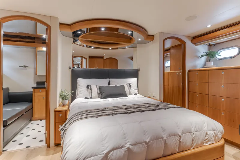 Slide: The Image of Luxurious bedroom interior of 2006 Cheoy Lee 72' Raised Pilot House yacht with elegant wood finishes. - 26