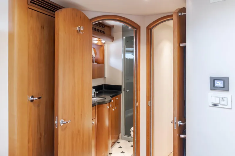 Slide: The Image of Luxurious 2006 Cheoy Lee 72' Raised Pilot House yacht interior with wood cabinetry and modern amenities. - 32