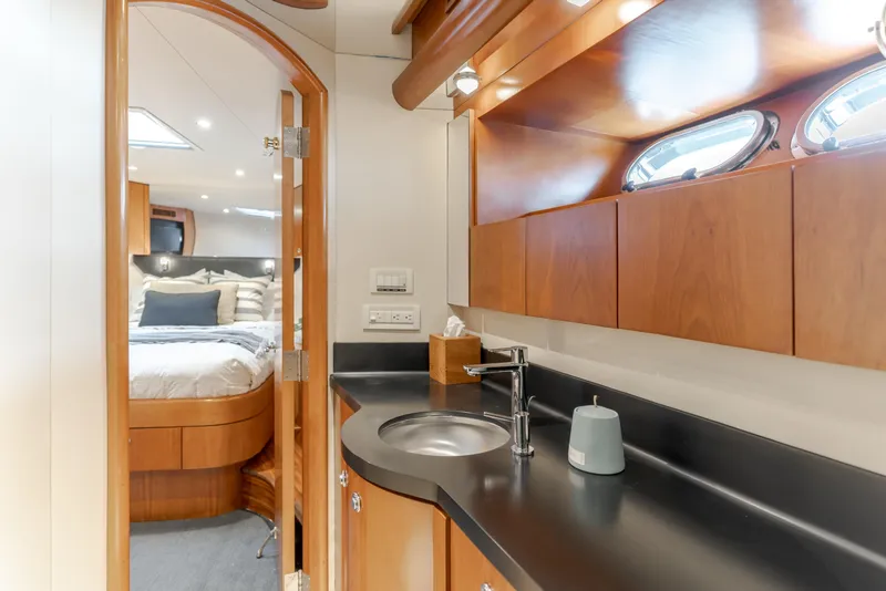 Slide: The Image of Luxurious 2006 Cheoy Lee 72' yacht interior with elegant wood finishes and modern amenities. - 34