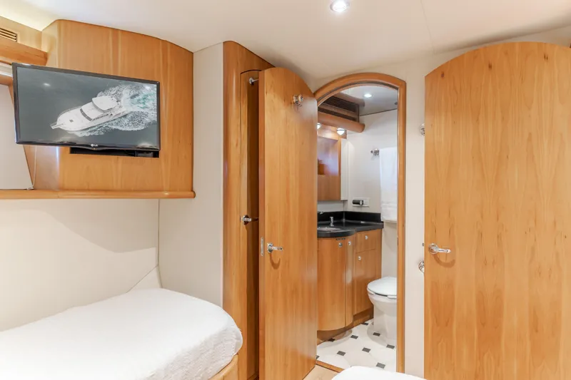 Slide: The Image of Luxurious 2006 Cheoy Lee 72' Raised Pilot House yacht interior with wood finish and ensuite bathroom. - 36