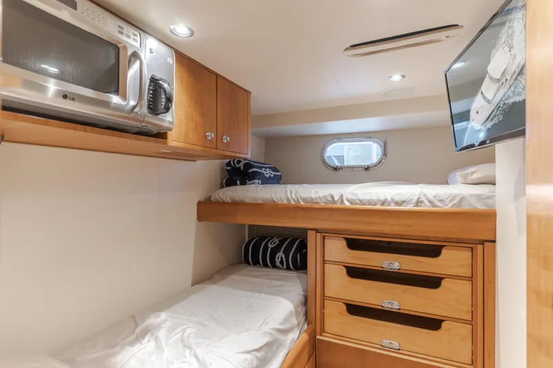 Slide: The Image of Cozy cabin interior of 2006 Cheoy Lee 72' Raised Pilot House yacht with bunk beds and storage. - 37