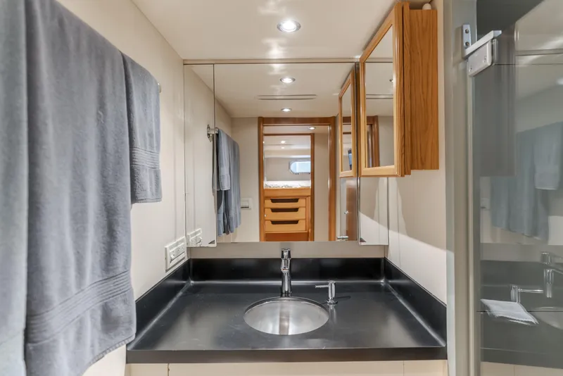Slide: The Image of Luxurious bathroom in 2006 Cheoy Lee 72' Raised Pilot House yacht, featuring sleek design. - 39