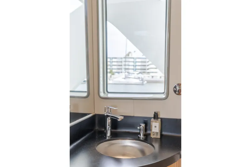 Slide: The Image of Modern bathroom sink with sleek faucet on 2006 Cheoy Lee 72' Raised Pilot House yacht. - 41