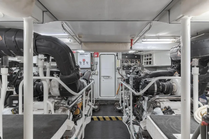 Slide: The Image of Engine room of 2006 Cheoy Lee 72' Raised Pilot House yacht, showcasing machinery and equipment. - 42