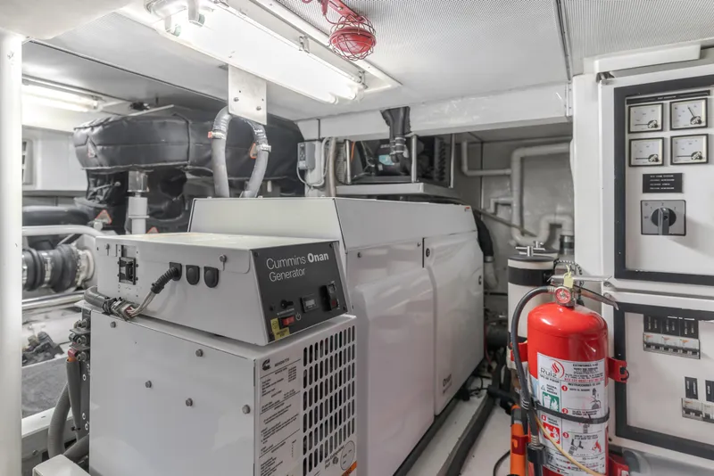 Slide: The Image of Engine room of 2006 Cheoy Lee 72' Raised Pilot House with Cummins Onan generator. - 43