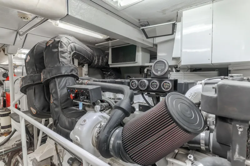 Slide: The Image of Engine room of 2006 Cheoy Lee 72' Raised Pilot House yacht, showcasing machinery and gauges. - 47