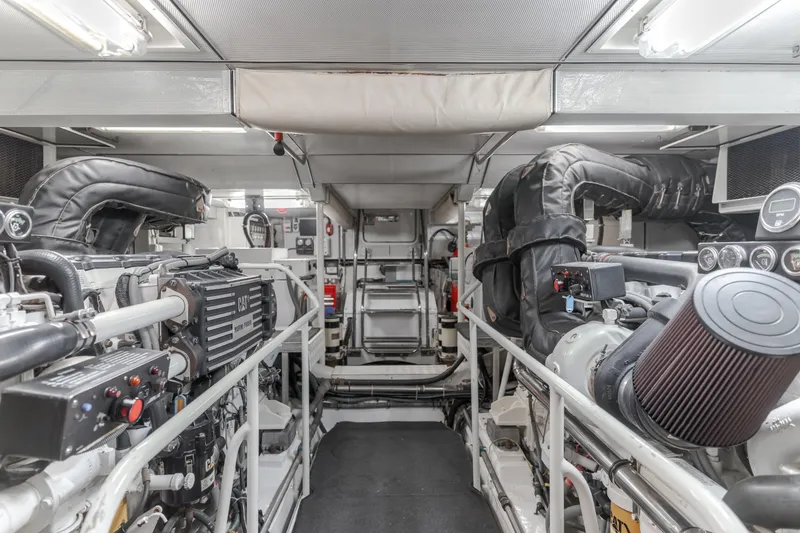 Slide: The Image of Engine room of 2006 Cheoy Lee 72' Raised Pilot House yacht, featuring advanced machinery. - 48