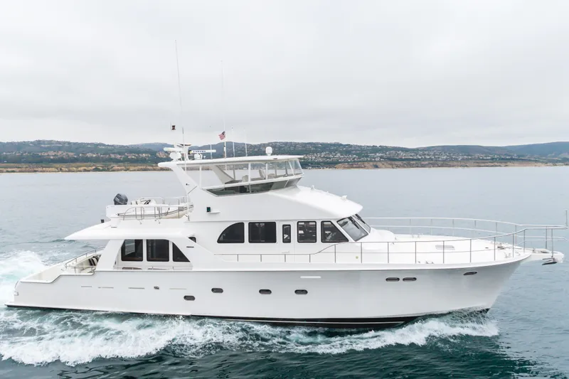 Slide: The Image of 2006 Cheoy Lee 72' Raised Pilot House yacht cruising on calm waters. - 49