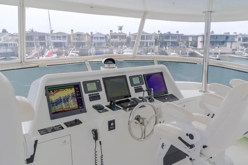 Slide: The Image of Pilot house interior of 2006 Cheoy Lee 72' yacht with navigation equipment and waterfront view. - 5