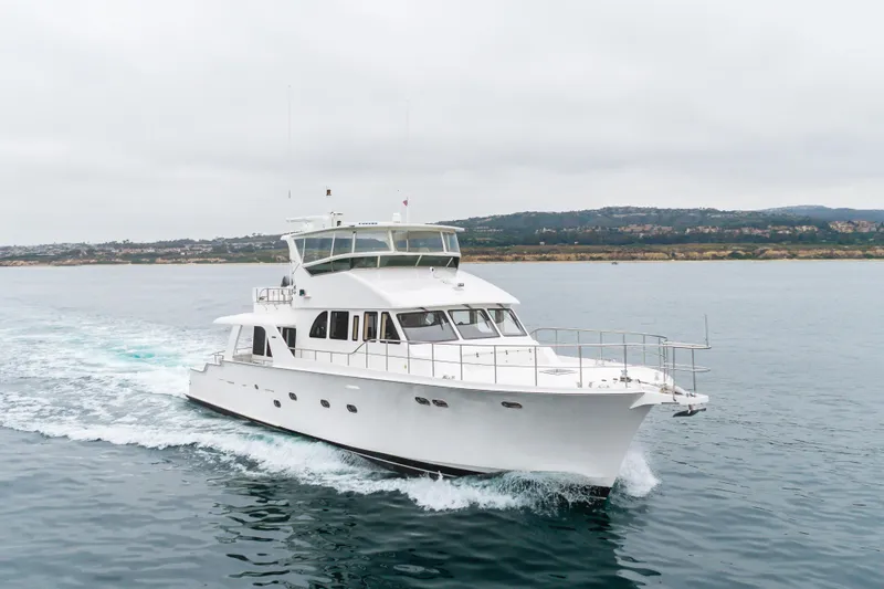 Slide: The Image of 2006 Cheoy Lee 72' Raised Pilot House yacht cruising on open water. - 53