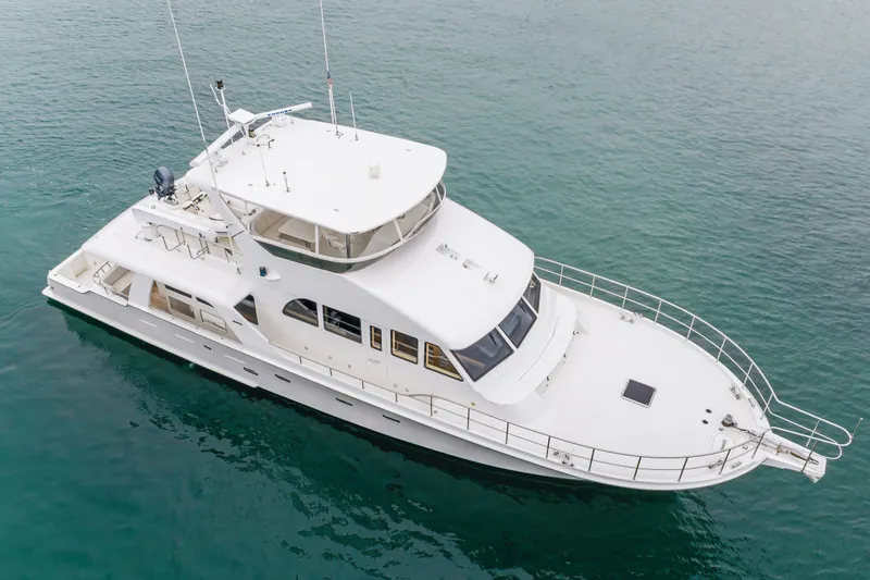 Slide: The Image of 2006 Cheoy Lee 72' Raised Pilot House yacht on calm water. - 56